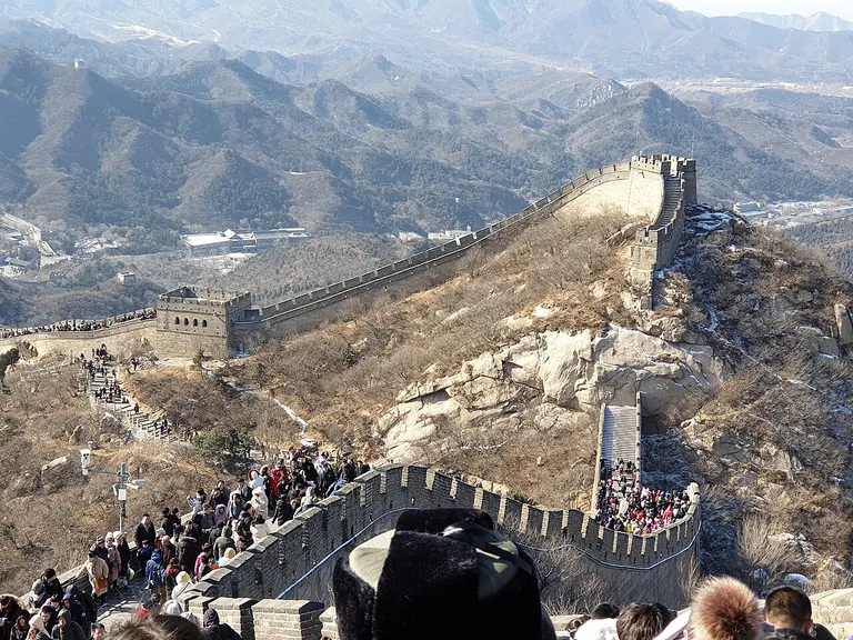 Crowds of tourists walk along the Great Wall of China at Badaling.