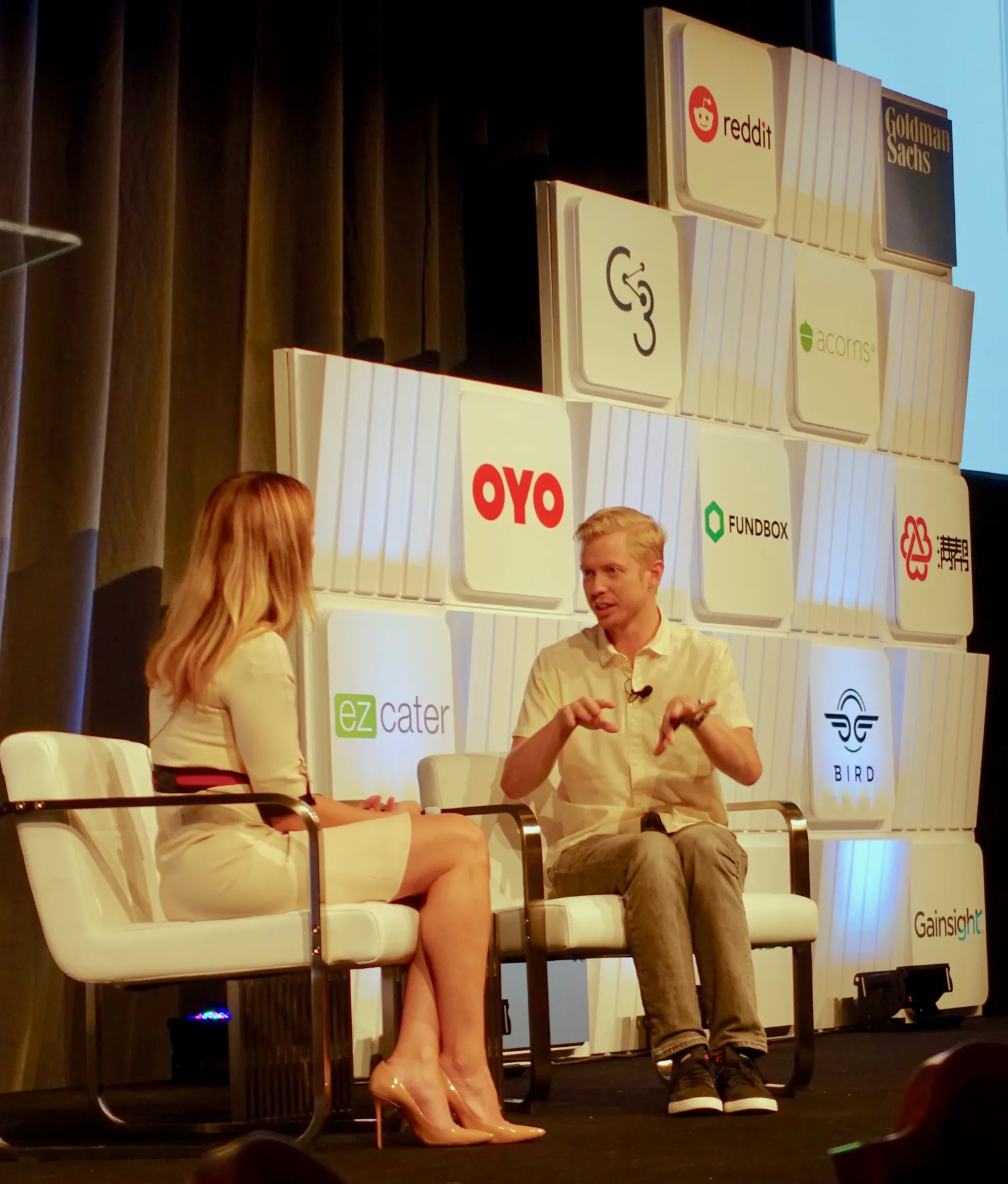 Reddit CEO Steve Huffman speaks with a moderator onstage at a Goldman Sachs private-company conference.