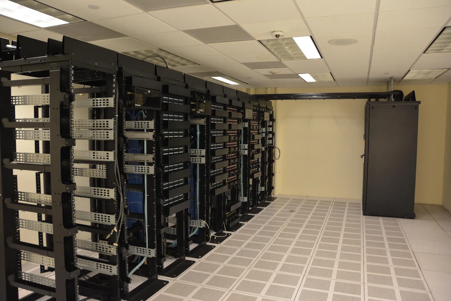 Network equipment racks in a server room; illustrative image, not an Amazon facility.