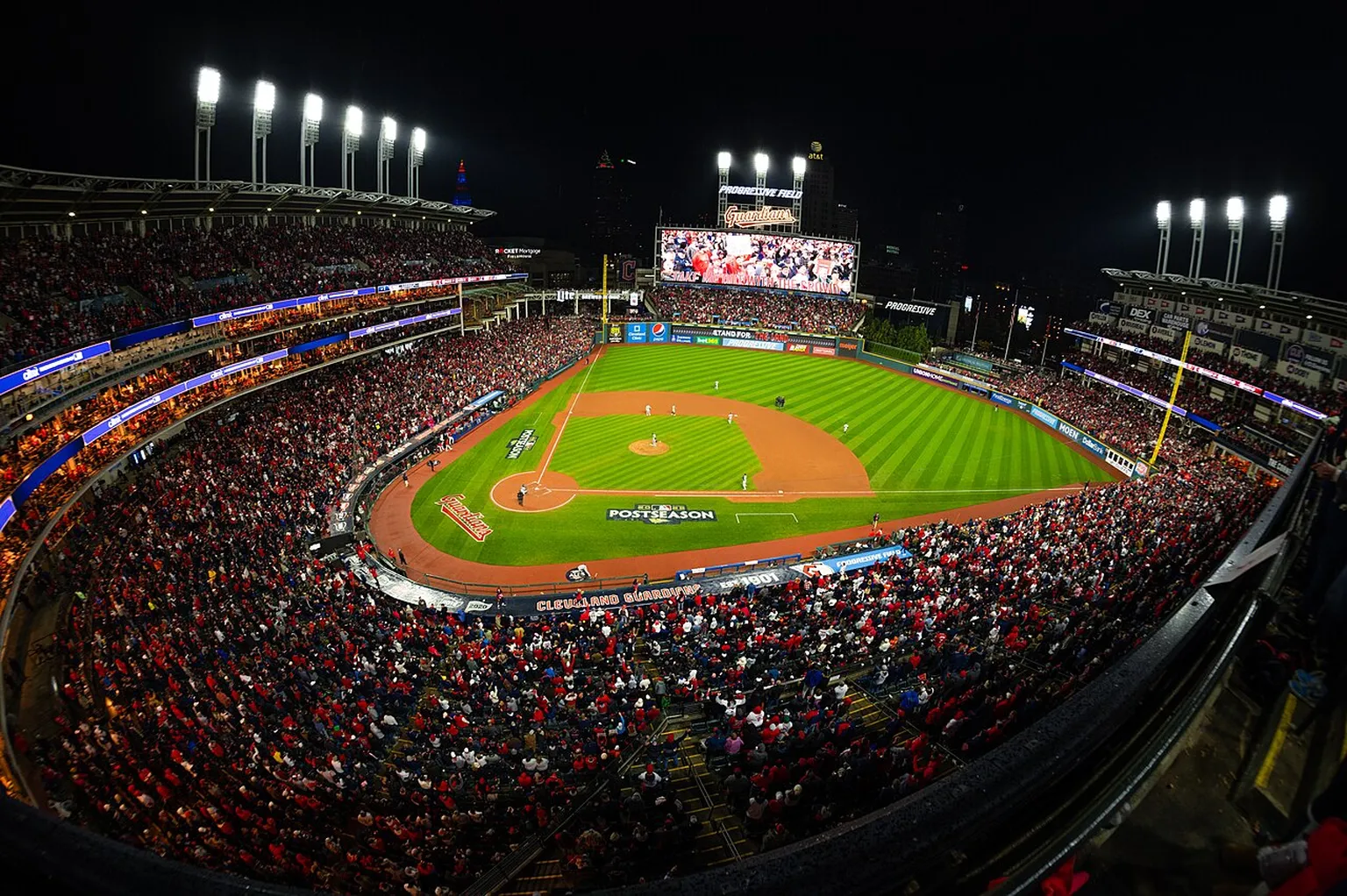 Crowd-filled Progressive Field during a 2022 Cleveland Guardians postseason game; an archival illustration, not a photograph of the 2026 rainout.